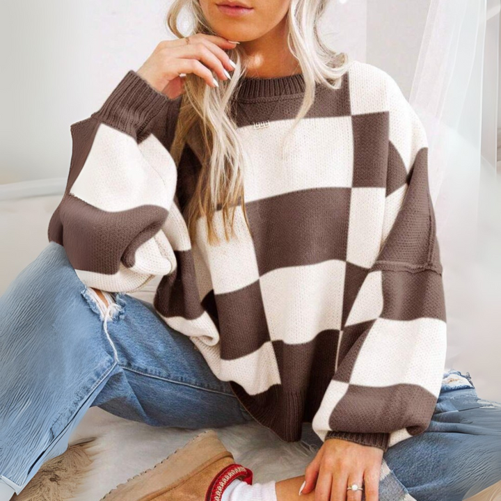 Brown and white checkered crewneck long-sleeve knit sweater with ribbed cuffs