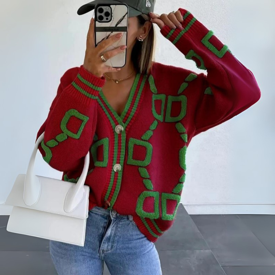 Red button-down cardigan with green geometric pattern, V-neck, long sleeves, button front