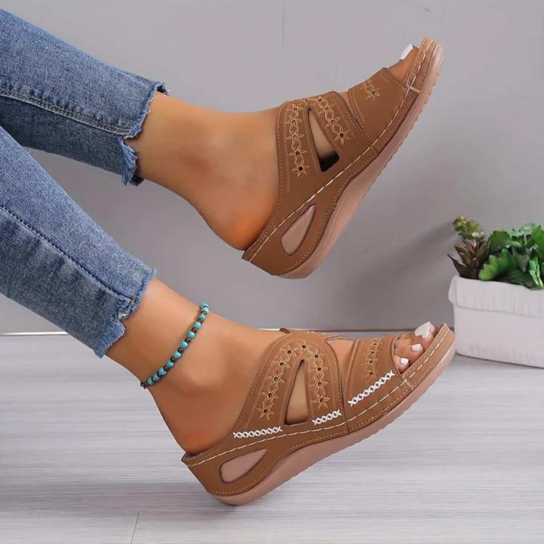 Orthopedic sandals with brown wide straps and cutout toe, stitched details, cushioned sole