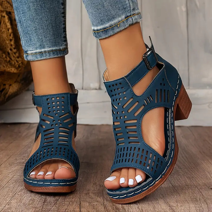 Navy blue ergonomic sandals with perforated upper and adjustable ankle buckle
