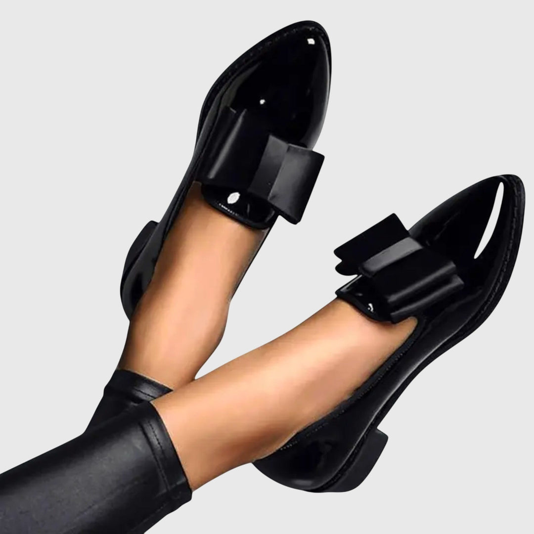 Black patent orthopedic loafer with wide black strap and rounded toe
