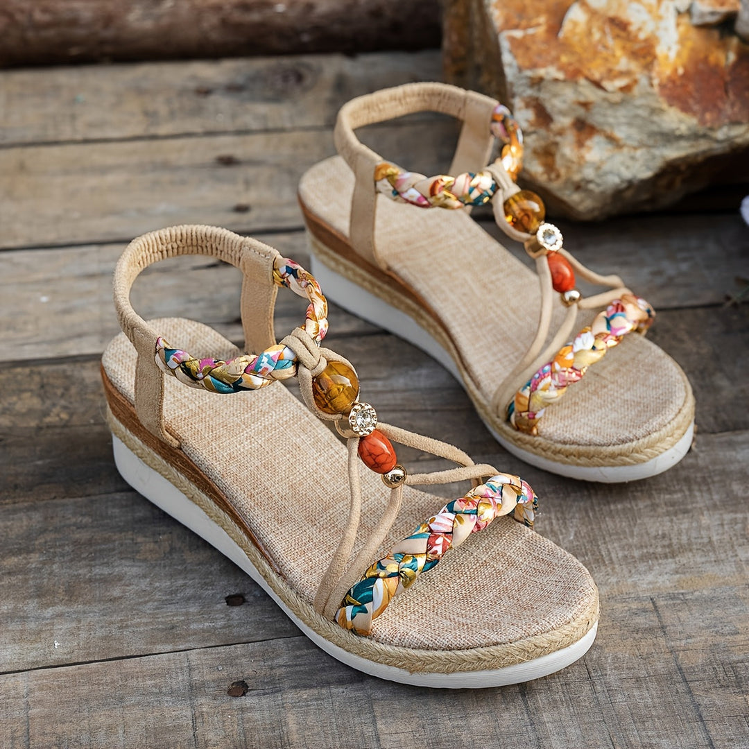 Beige orthopedic espadrille sandals with braided straps and gold bead charms, wedge sole