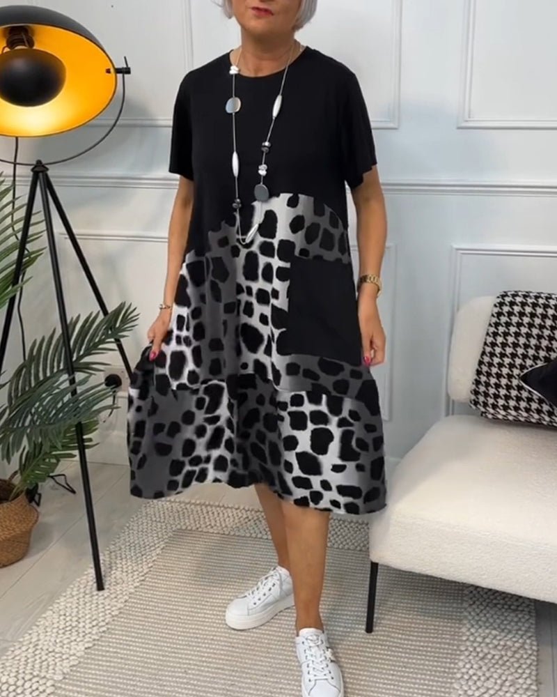 Women's black midi dress with leopard print skirt, short sleeves, round neckline