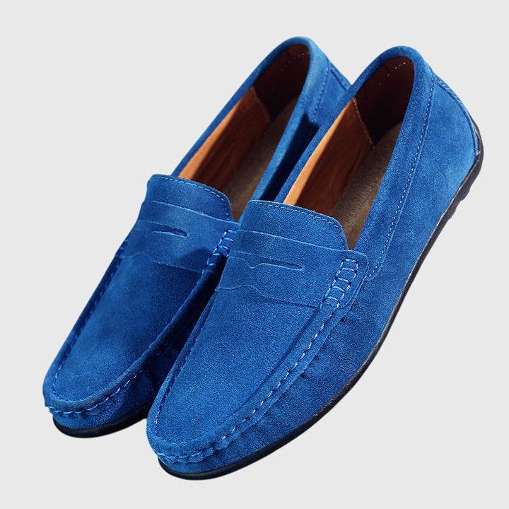 Light blue suede orthopaedic loafers with slip-on penny strap and stitched seam