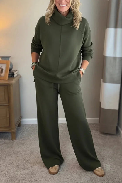 Green coordinated zip-front hoodie top and wide-leg pants set.