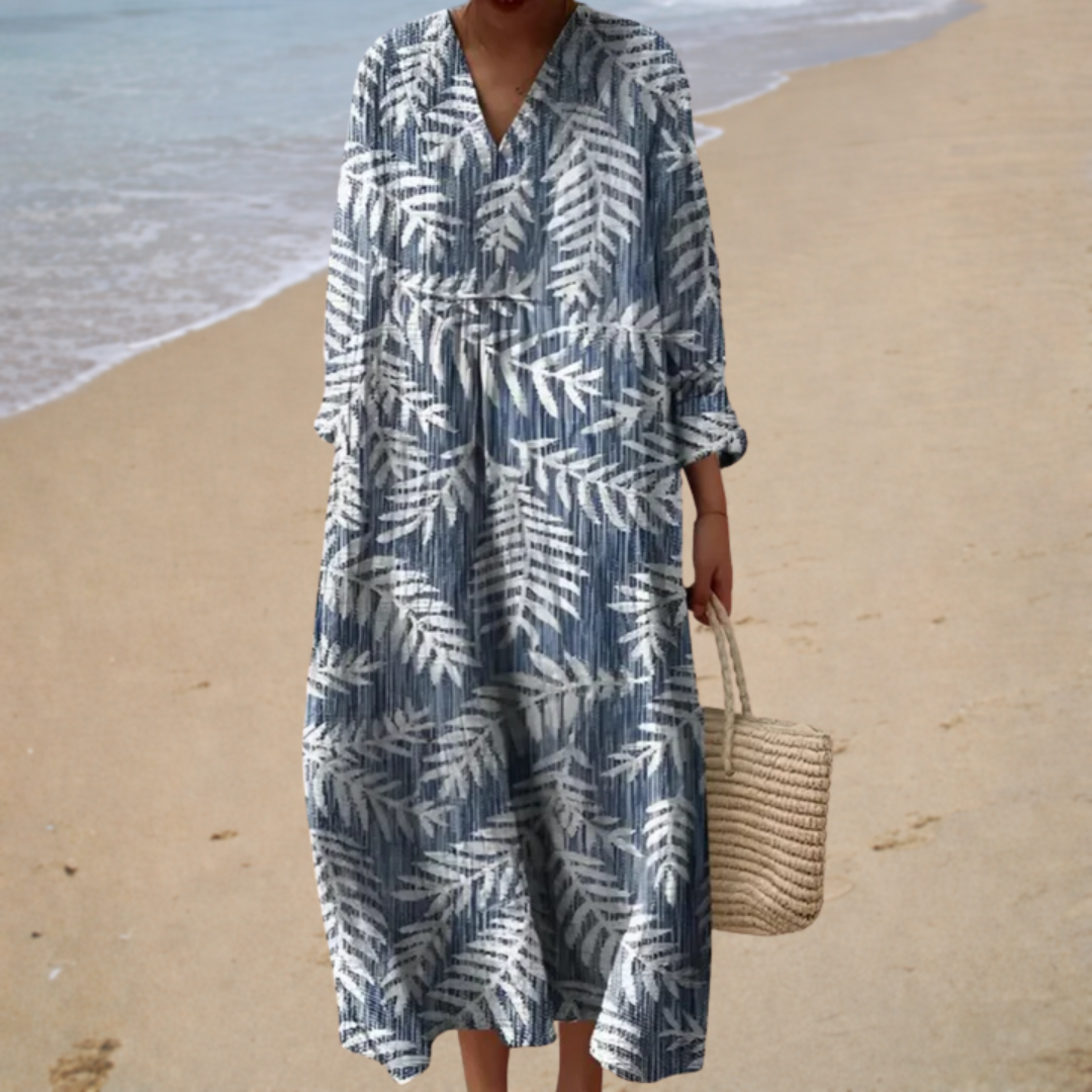 Flattering printed summer dress with blue-and-white palm leaves, V-neck, three-quarter sleeves.