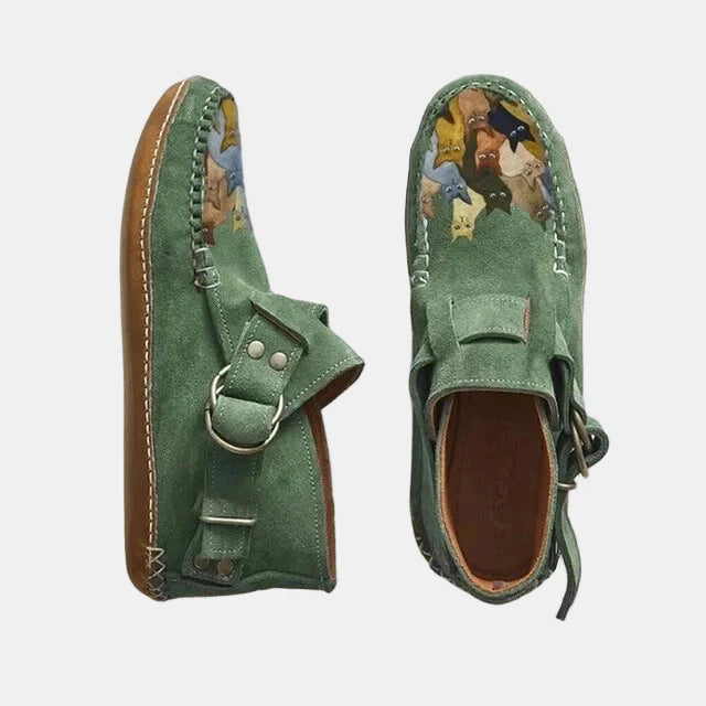 Printed ankle boots in green suede with buckle strap and lace tie, animal print lining