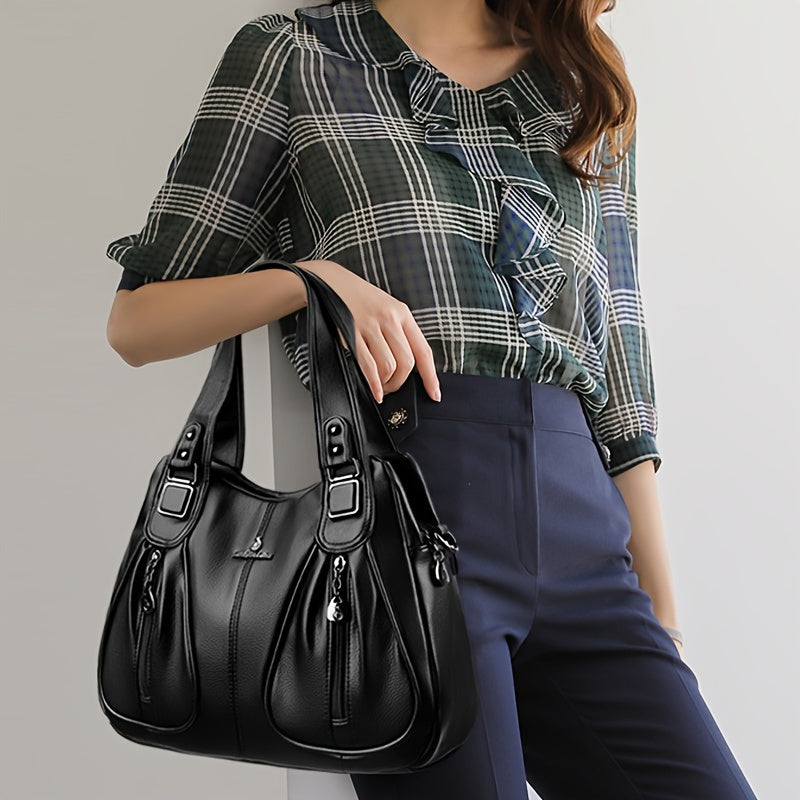 Women’s casual shoulder bag, black leather-look with top handles and side buckles