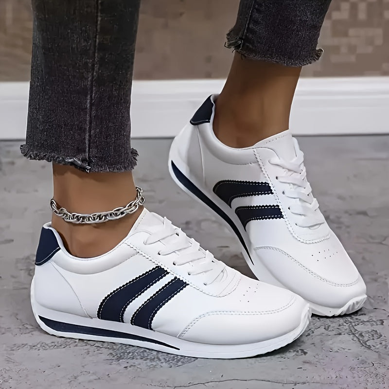 White lace-up orthopedic sneakers with navy stripes and stitched panel details