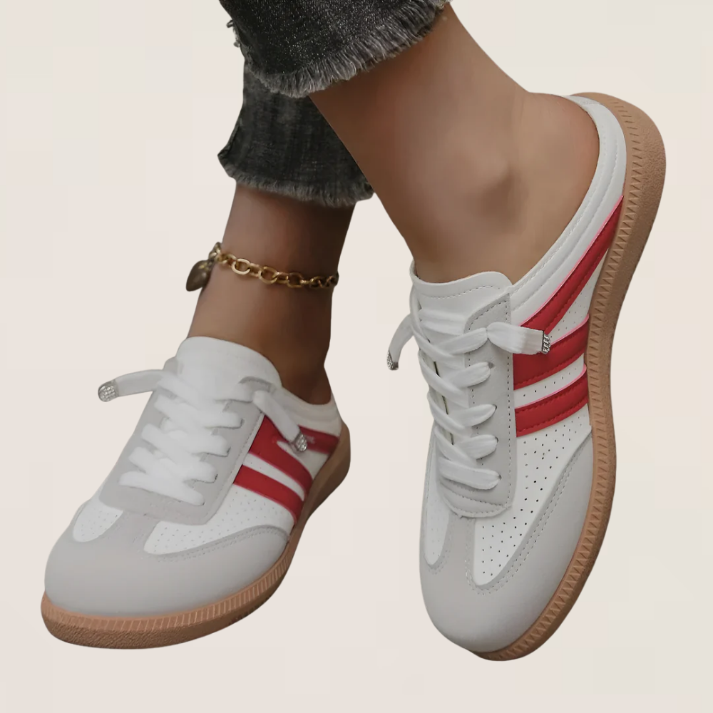 White retro sneakers with red side panel stripes, gum sole, lace-up front.