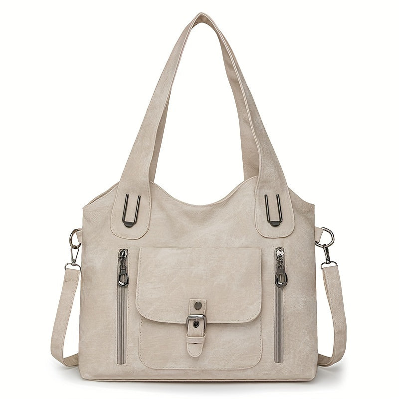 Beige suede-look shoulder bag with top handles, front flap pocket, and side zippers