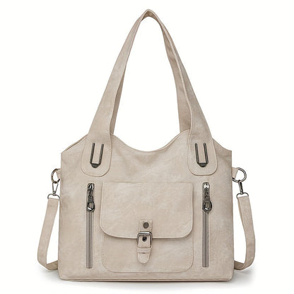 Beige suede-look shoulder bag with top handles, front flap pocket, and side zippers