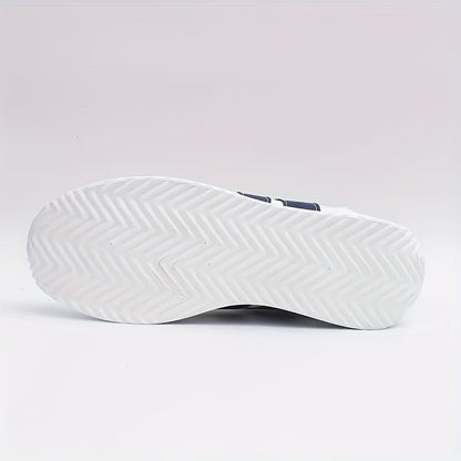 White sneaker outsole with textured tread and navy heel detail
