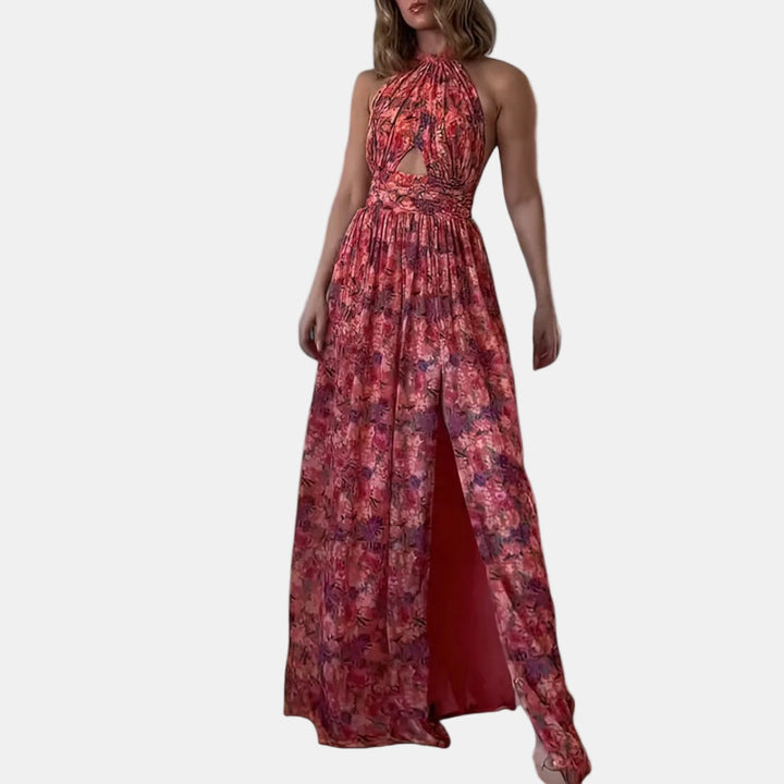 Floral maxi dress with halter neckline, sleeveless bodice, and side-slit skirt