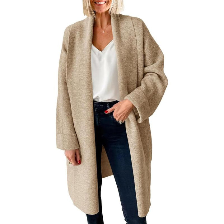 Beige oversized long open-front cardigan, chunky knit with relaxed drape.