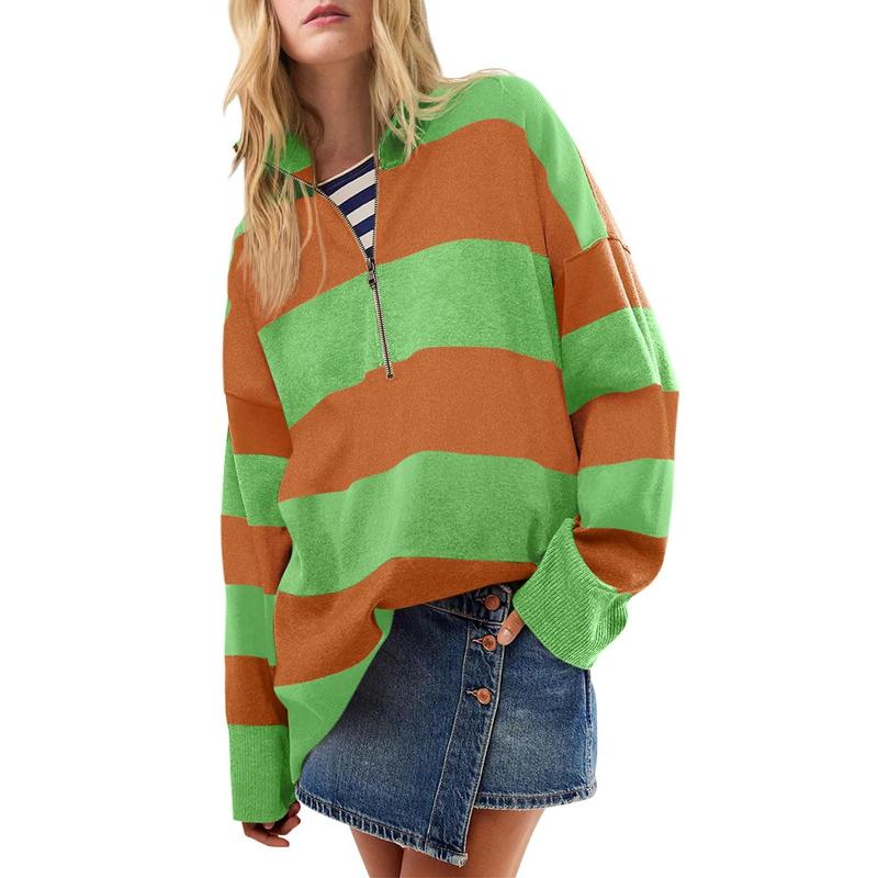 Oversized turtleneck sweater with green-and-orange striped half-zip