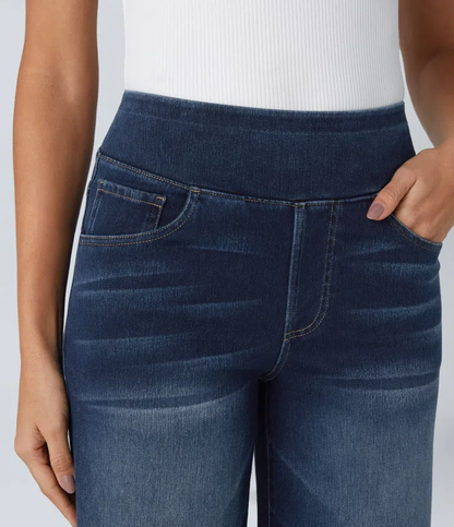 Blue denim jeans close-up: front pockets, curved yoke seams, relaxed wide-leg rise