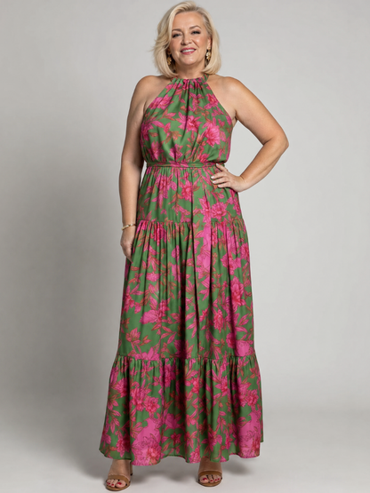 Floral halter midi dress front view with tiered ruffles, pink blooms on green, gathered waist.
