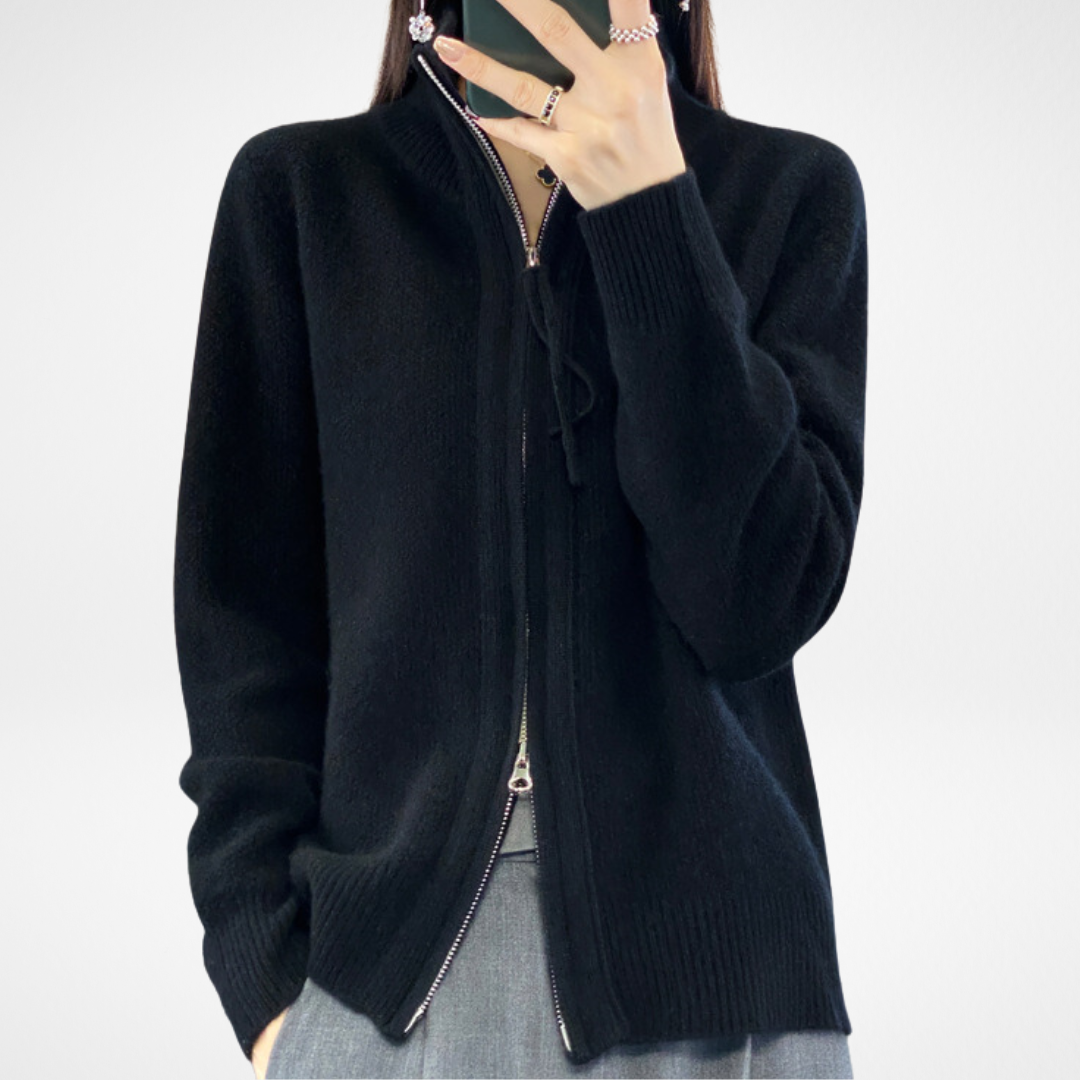 Black zip-front knit sweater with stand collar and drawstring