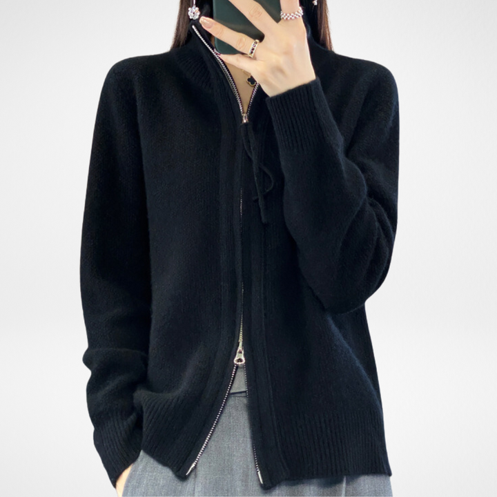 Black zip-front knit sweater with stand collar and drawstring
