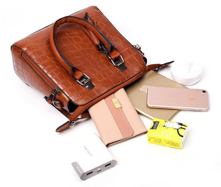 Brown croc-pattern handbag set with tote, shoulder strap, and matching small card pouch