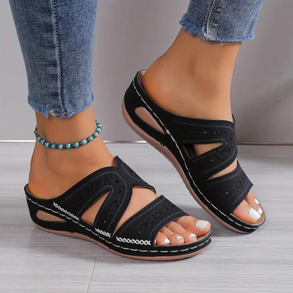 Orthopedic sandals with black wide straps and open toe, stitched trim, cushioned low sole