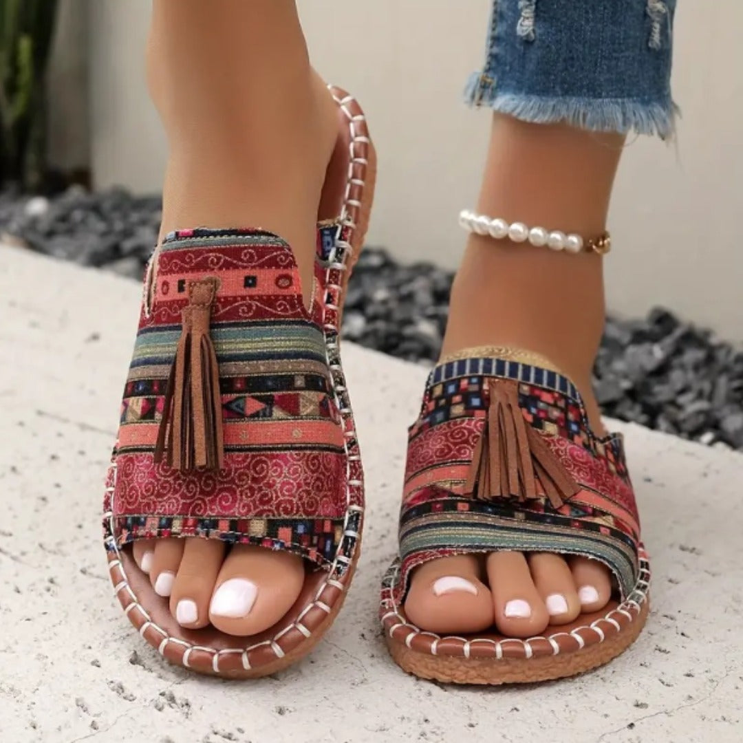 Printed slip-on sandals with toe ring, tassel front, and rope-stitched trim, red pattern