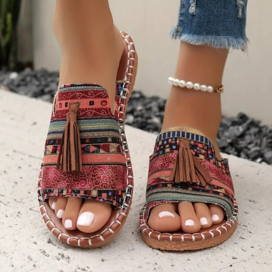 Printed slip-on sandals with toe ring, tassel front, and rope-stitched trim, red pattern