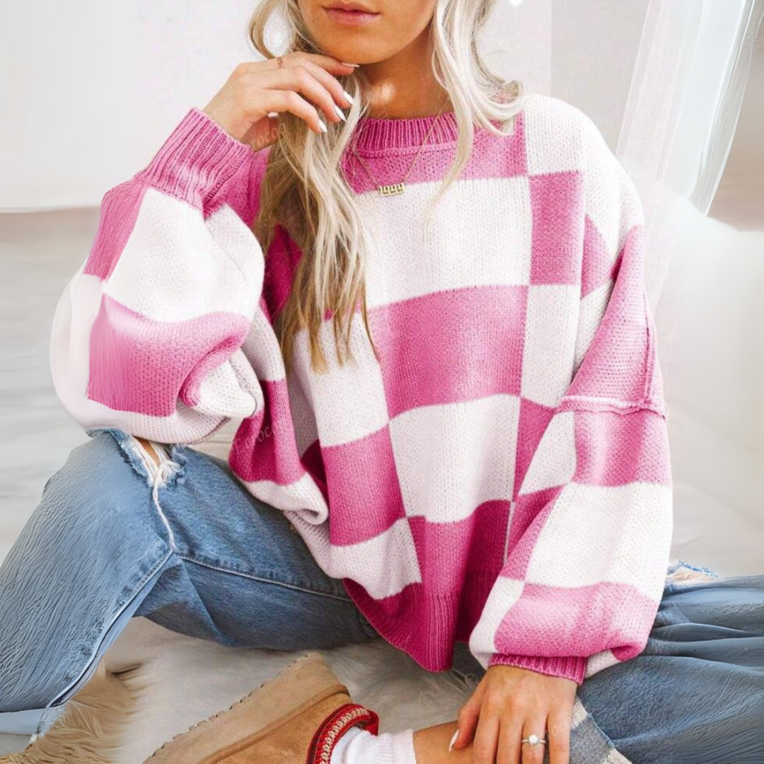 Light pink and white checkered crewneck long-sleeve knit sweater with ribbed cuffs