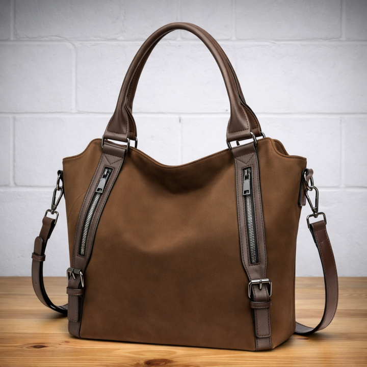 Coffee-brown hobo tote bag with dual zip pockets, top handles, and adjustable crossbody strap