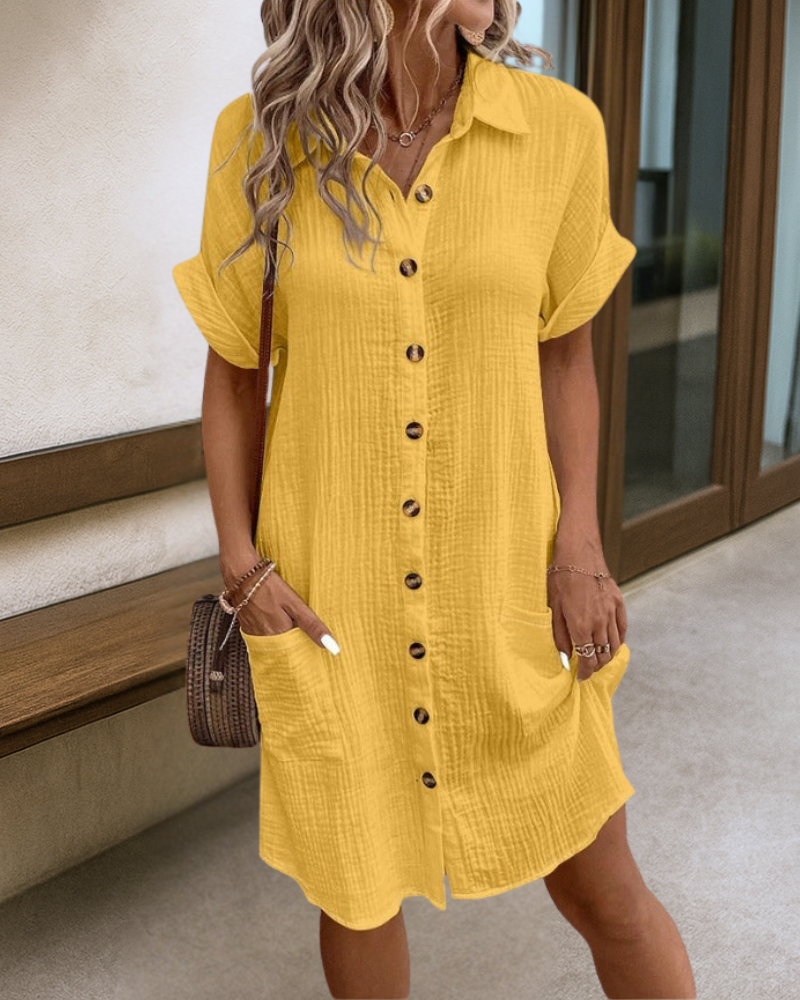 Yellow button-front midi dress with short sleeves and pointed collar, chest pockets.