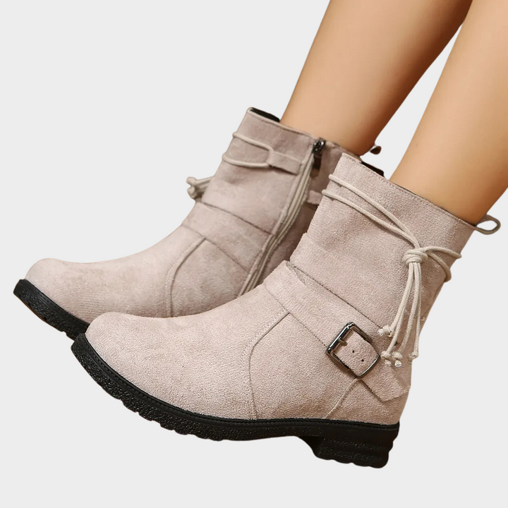 Light taupe low-heel ankle boots with side zipper and lace-up ankle strap