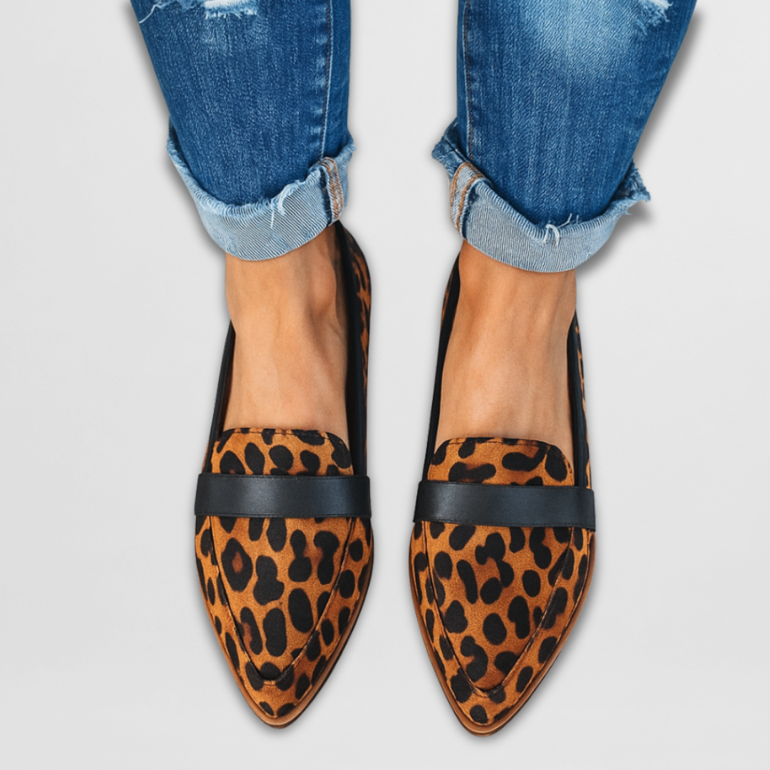 Leopard-print suede loafers with black slip-on strap and pointed toe