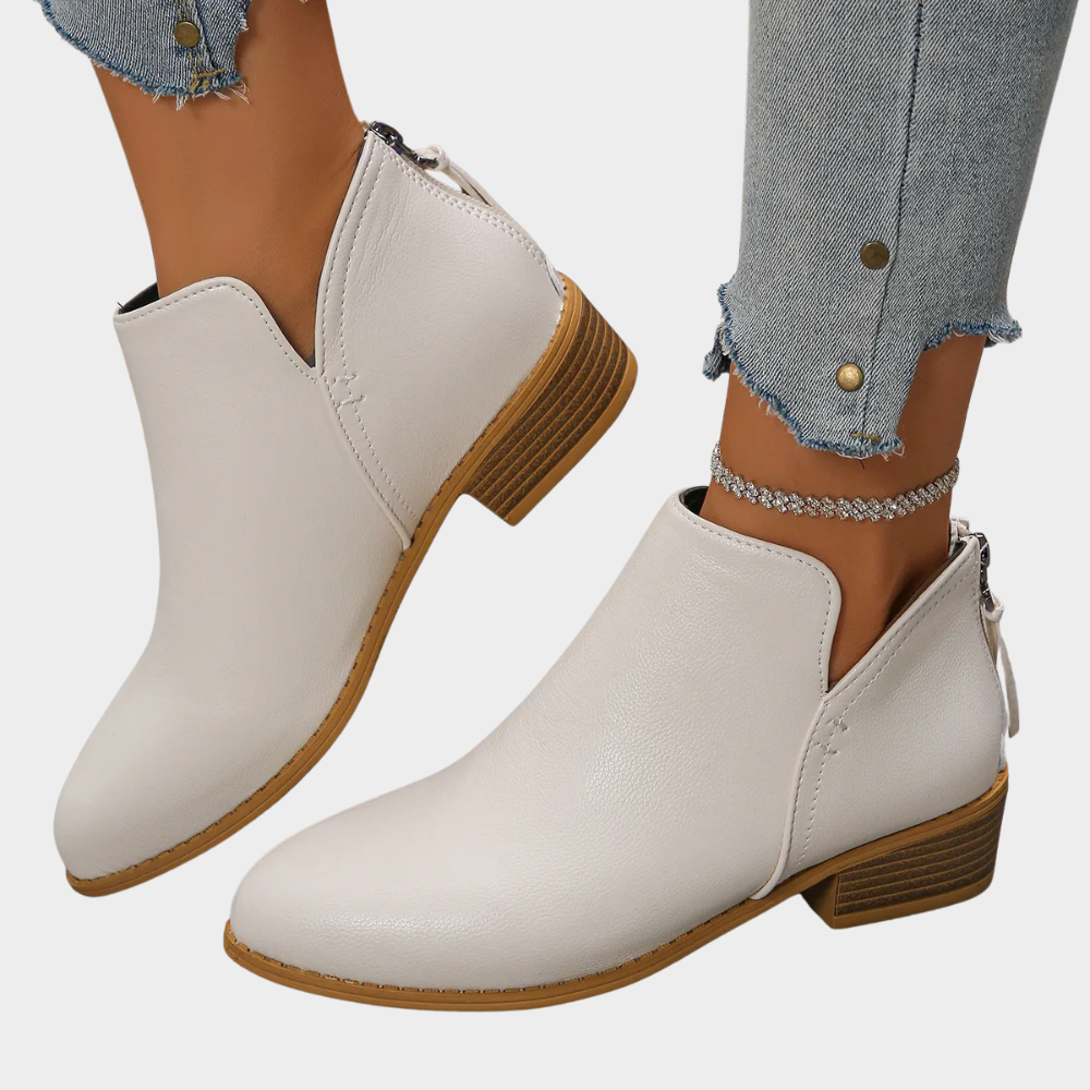 White ankle boots with low block heel and side zipper closure