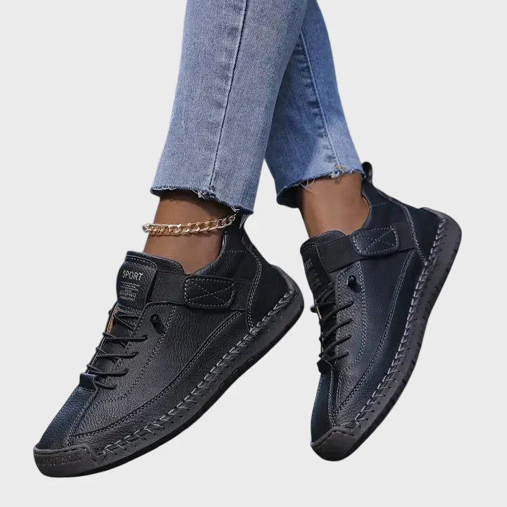 Orthopedic sneakers in black with lace-up front, hook-and-loop strap, and cushioned sole