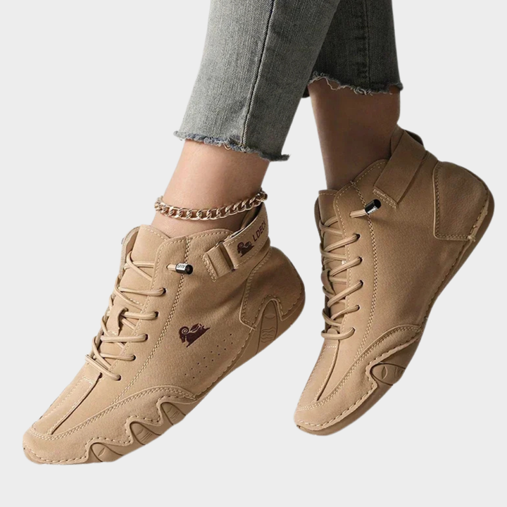 Tan orthopedic ankle boots with lace-up front, side strap detail, cushioned sole