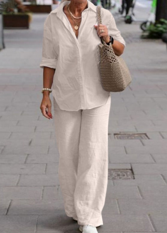 Beige two-piece set: relaxed button-up top with wide-leg trousers.