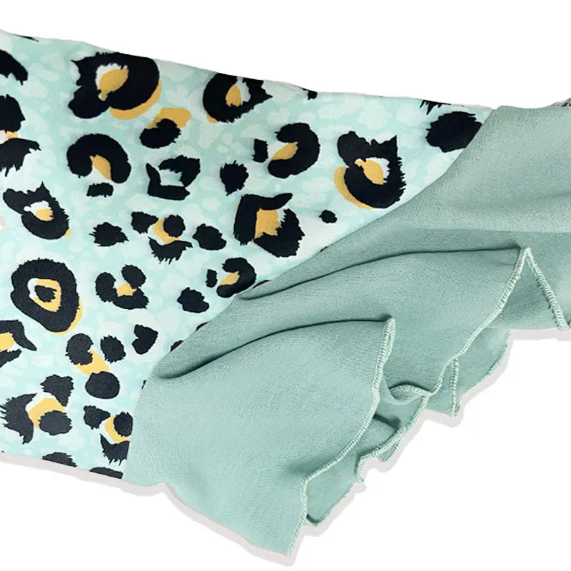 Women’s sleeve panel with teal trim and leopard-print fabric in black and yellow