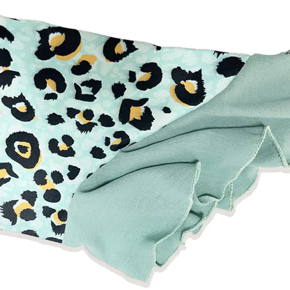 Women’s sleeve panel with teal trim and leopard-print fabric in black and yellow