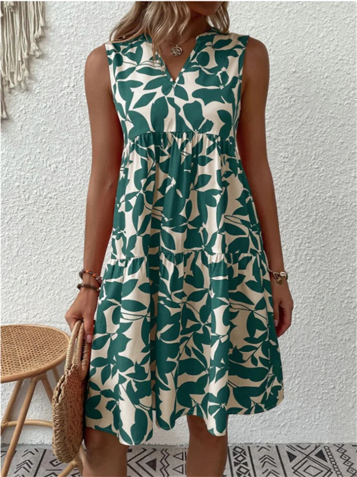 Green leaf-print sleeveless V-neck flowy dress with gathered tiered skirt