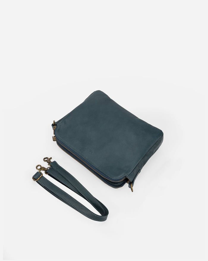 Jovie sleek three-layer crossbody bag in dark teal with wrist strap and zip closure