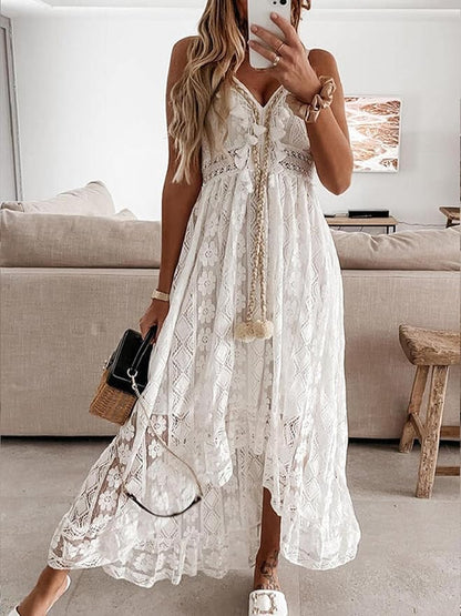 White boho lace dress with V-neck, sleeveless cut, tiered skirt and embroidered trim