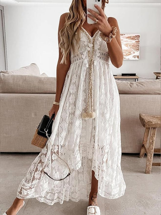 White boho lace dress with V-neck, sleeveless cut, tiered skirt and embroidered trim