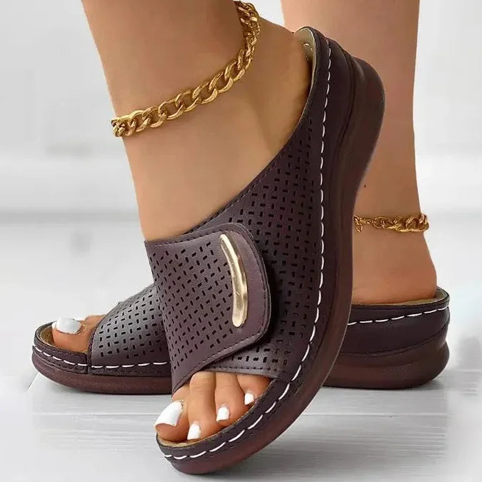 Perforated slide sandals in dark purple with wide toe strap and cushioned sole