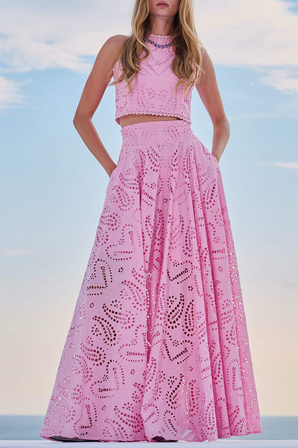 Pink embroidered sleeveless crop top and high-waist maxi skirt set with eyelet floral texture