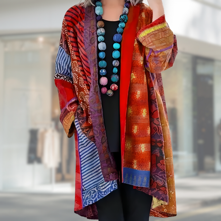 Multicolor boho patchwork cardigan with open front and long sleeves, red with blue and gold blocks