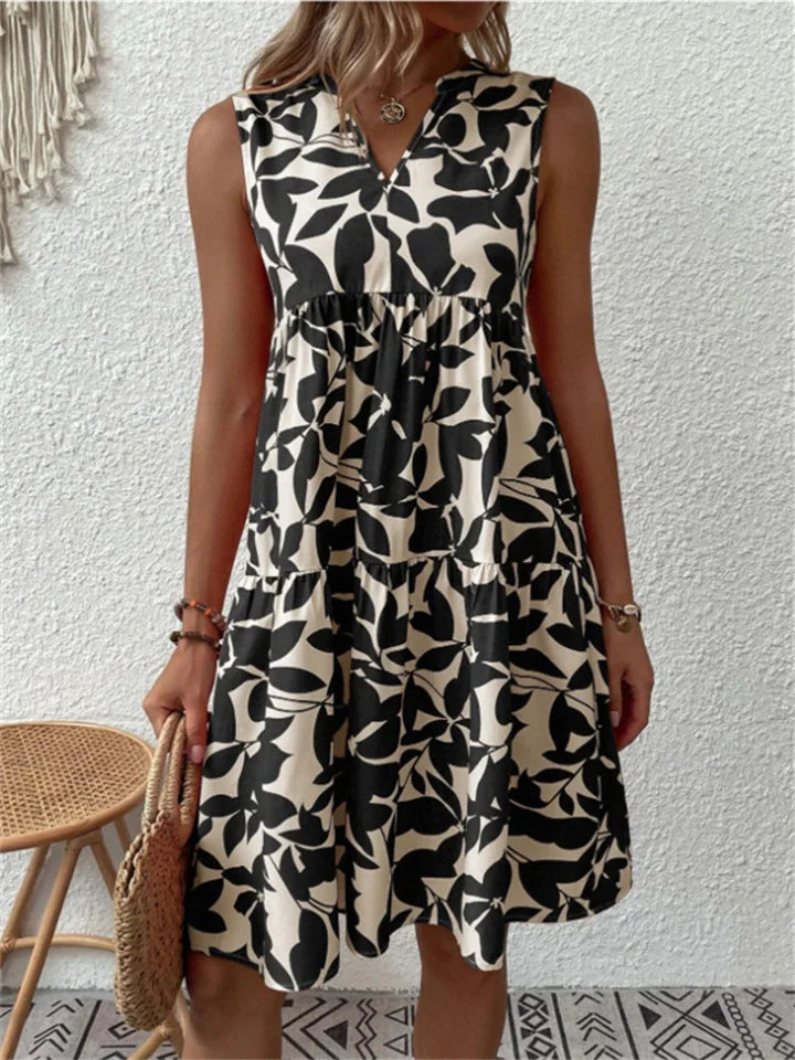 Black leaf-print sleeveless V-neck flowy dress with gathered tiered skirt