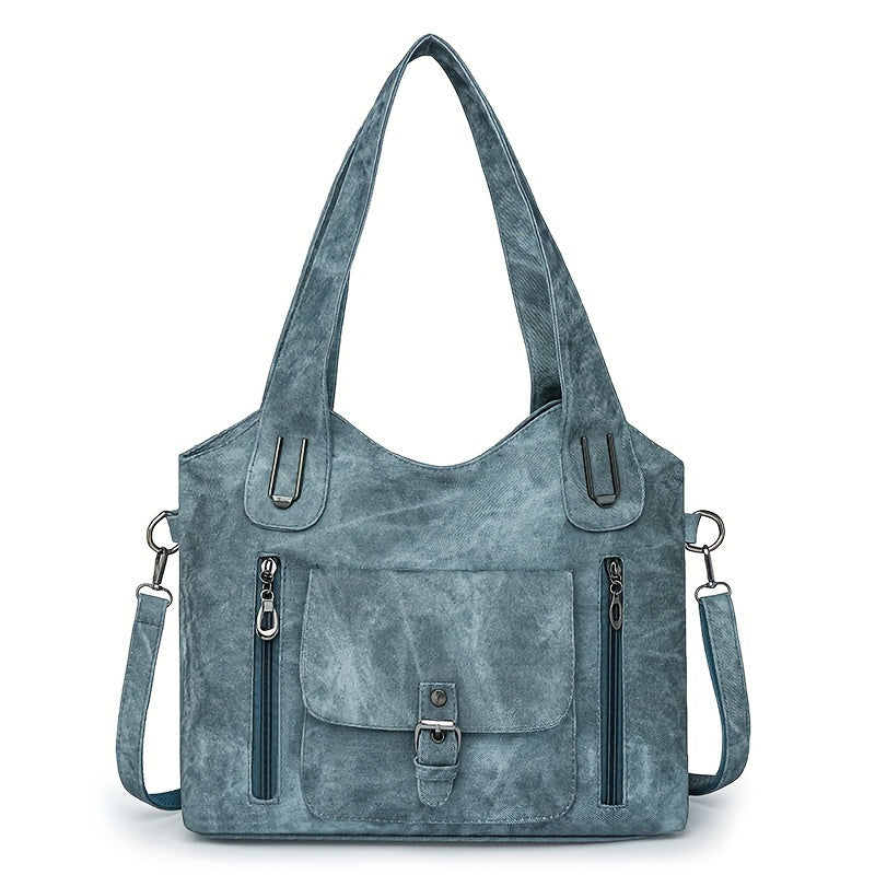 Sky blue suede-look shoulder bag with top handles, flap pocket, and side zippers