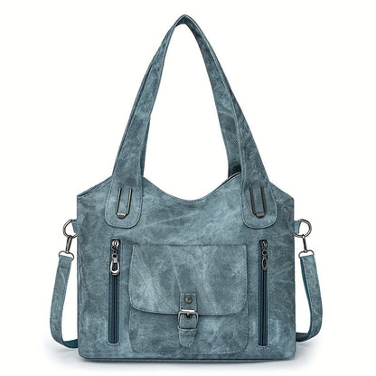 Sky blue suede-look shoulder bag with top handles, flap pocket, and side zippers