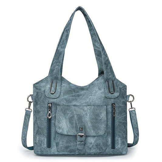 Sky blue suede-look shoulder bag with top handles, flap pocket, and side zippers
